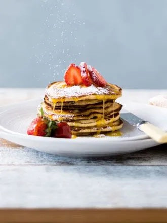 Golden, Fluffy Pancakes With Orange Sauce